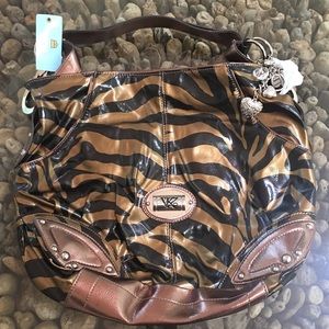 KATHY VAN ZEELAND bronze zebra print bag.